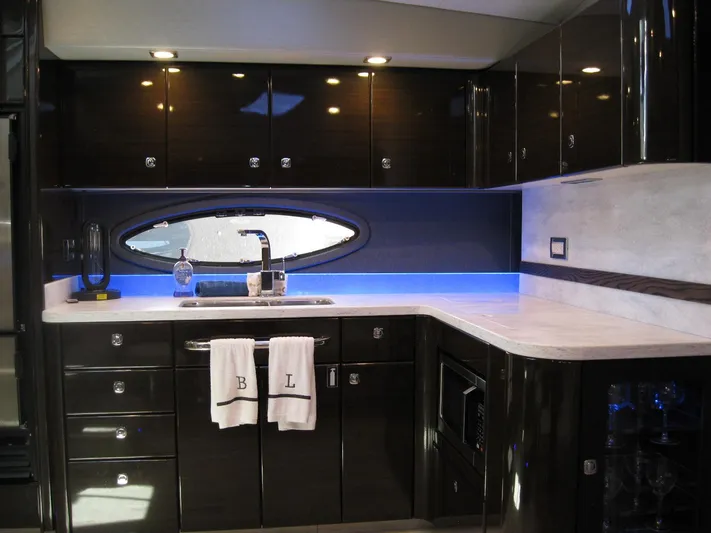  Yacht Photos Pics Luxurious kitchen interior of 2017 Formula 45 Yacht with modern cabinetry and ambient lighting.