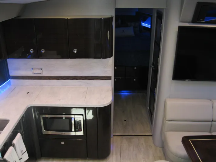  Yacht Photos Pics Interior of 2017 Formula 45 Yacht featuring modern kitchen and seating area.