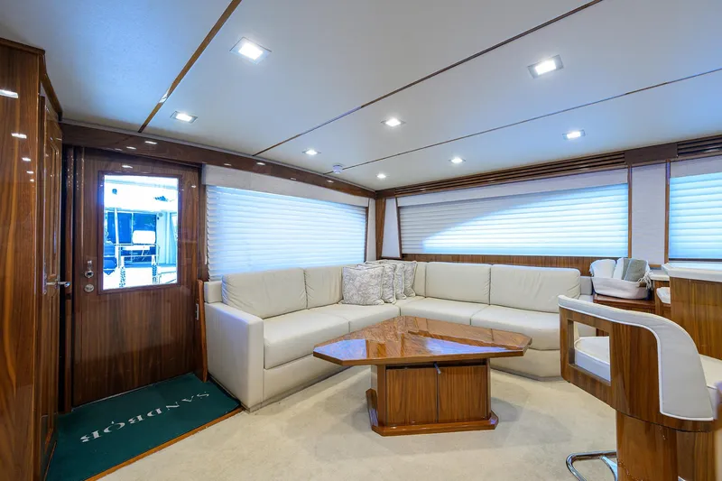 Sandbob II Yacht Photos Pics Luxurious interior of 2021 Viking 72 Convertible yacht with elegant seating and wooden accents.