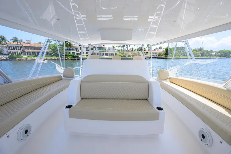 Sandbob II Yacht Photos Pics Luxurious interior of 2021 Viking 72 Convertible yacht with beige seating and waterfront view.