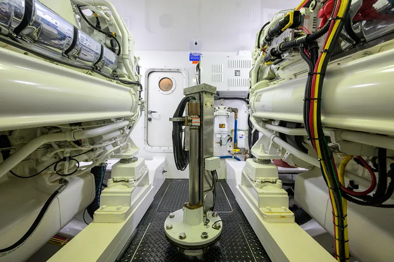 Sandbob II Yacht Photos Pics Engine room of 2021 Viking 72 Convertible yacht, showcasing machinery and equipment.