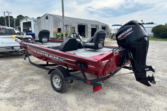 2023 Tracker Pro Team 175 TXW boat with Mercury engine, parked on a trailer.