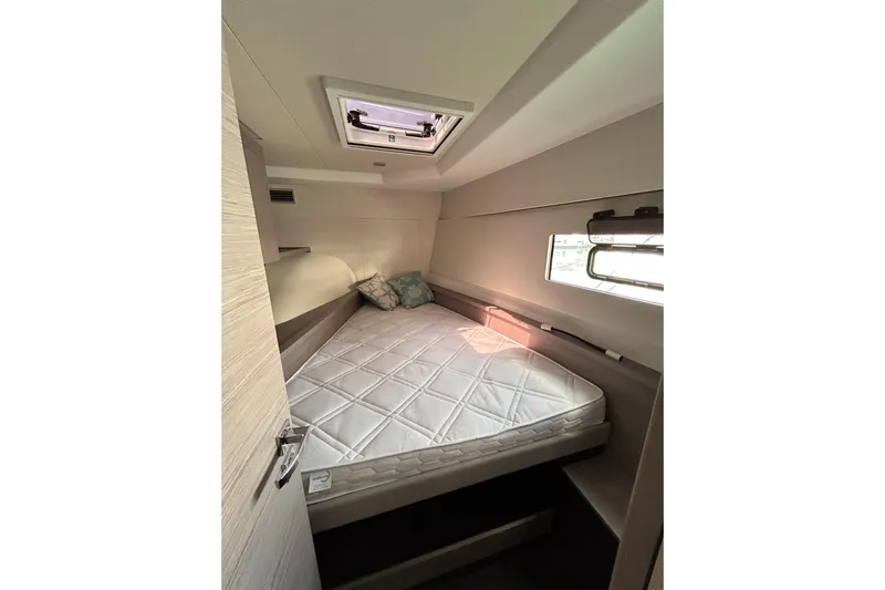  Yacht Photos Pics 2025 Fountaine Pajot MY4.S cabin interior with bed and window.