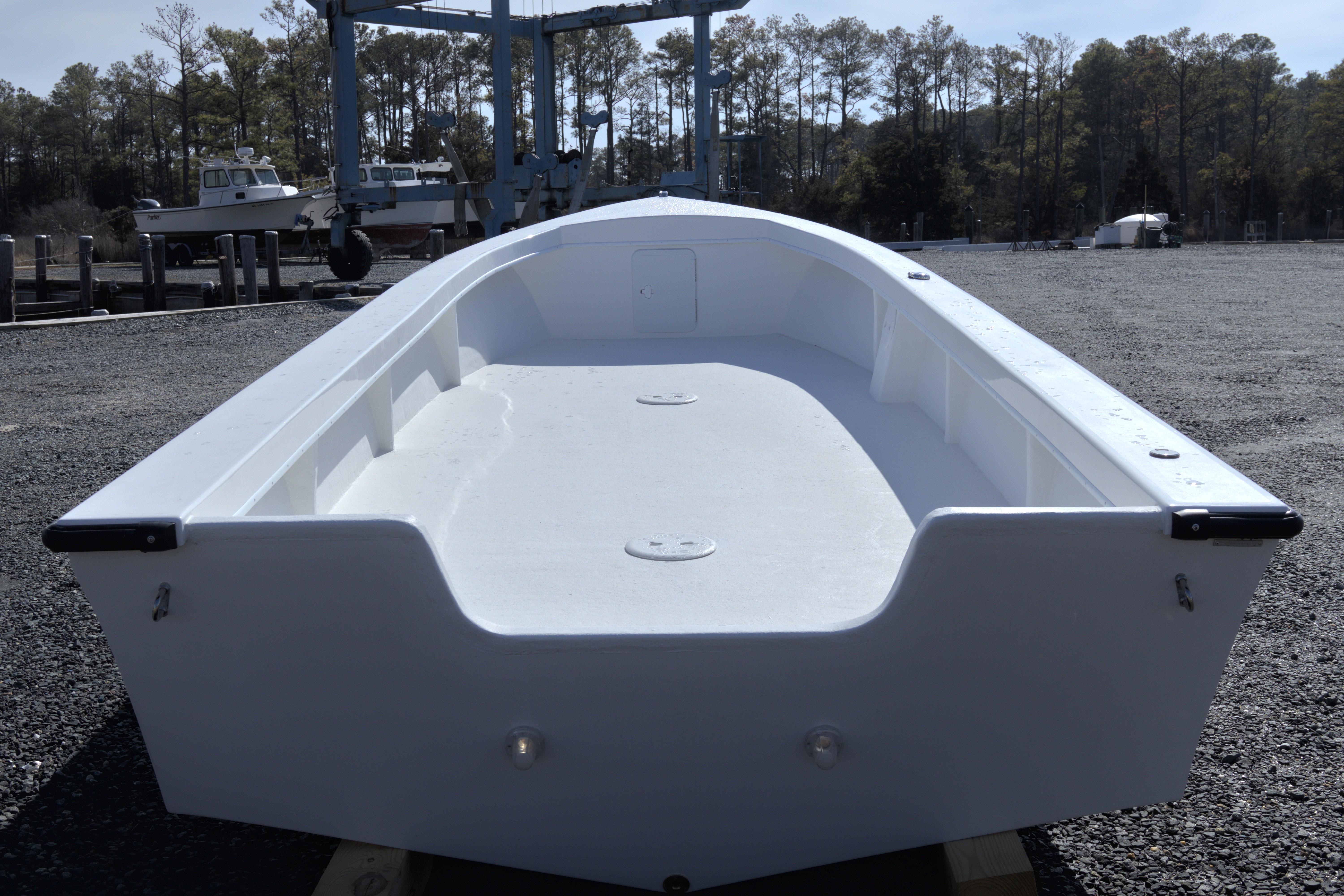 2026 C-Hawk 22 Commercial boat on display in a marina setting.