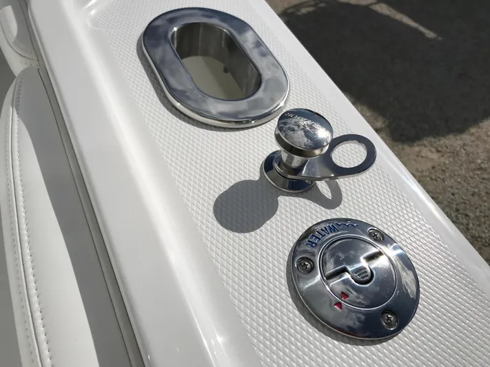 Regulator 23 Carolina Blue Yacht Photos Pics 2023 Regulator 23 boat deck with chrome fittings and textured surface.