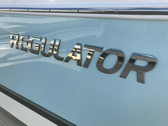 Regulator 23 Carolina Blue Yacht Photos Pics 2023 Regulator 23 boat logo on light blue hull.
