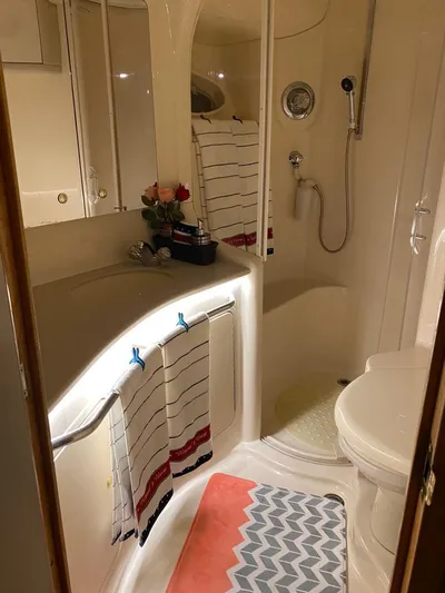  Yacht Photos Pics Luxurious bathroom in 2000 Sea Ray 515 Sedan Bridge yacht with modern amenities.