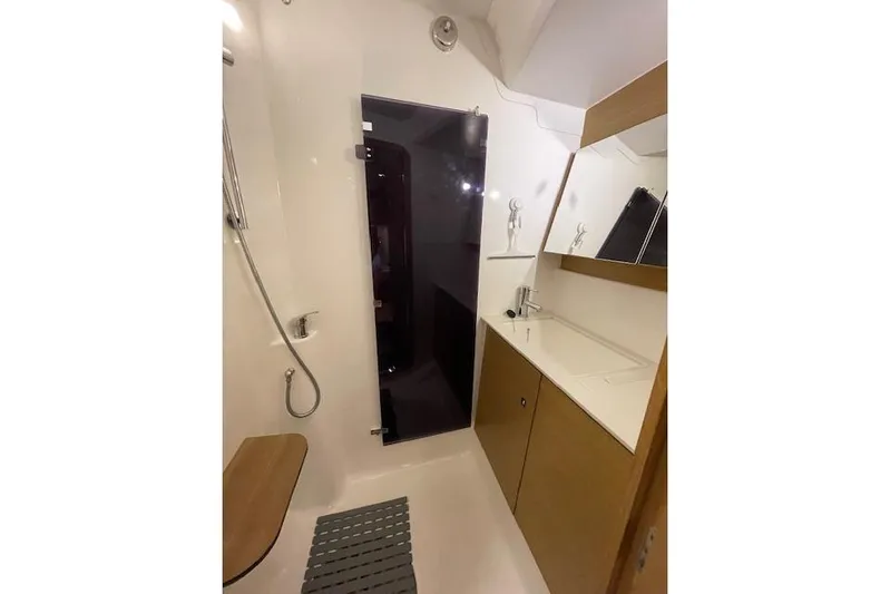  Yacht Photos Pics Bathroom interior of 2015 Dufour 560 Grand Large yacht, featuring modern fixtures and sleek design.