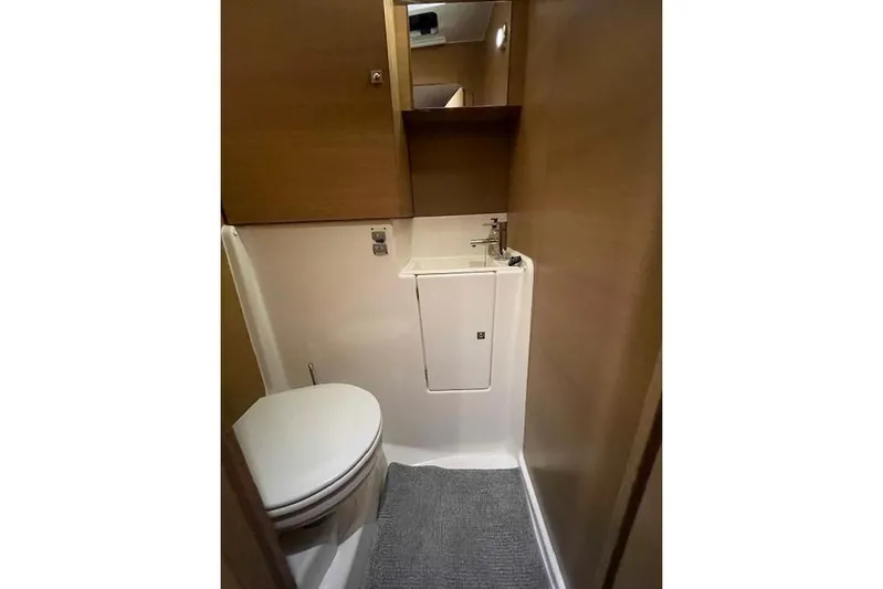  Yacht Photos Pics Bathroom interior of 2015 Dufour 560 Grand Large yacht, featuring compact design and modern fixtures.
