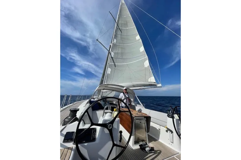  Yacht Photos Pics Sailing on a 2015 Dufour 560 Grand Large yacht under clear blue skies.