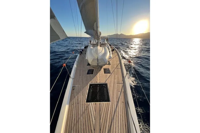  Yacht Photos Pics Sailing on a 2015 Dufour 560 Grand Large yacht at sunset, open sea view.