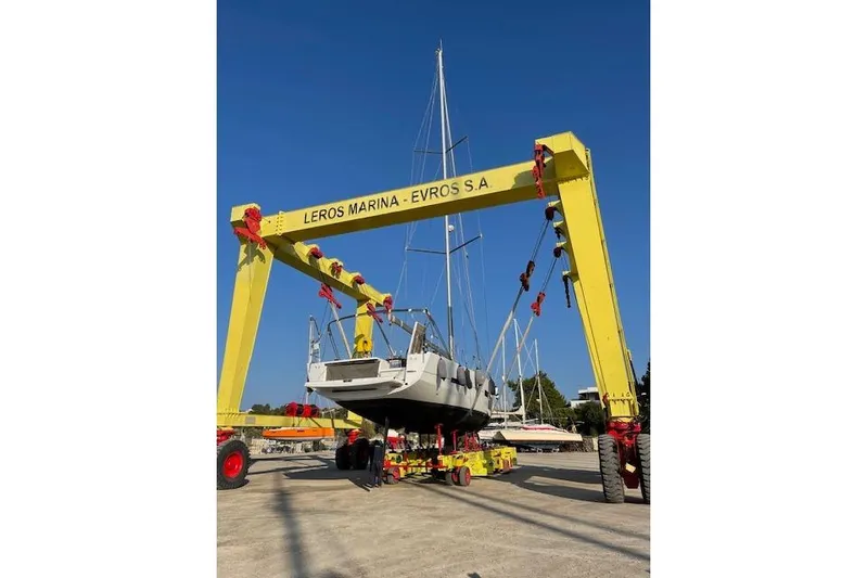  Yacht Photos Pics Dufour 560 Grand Large 2015 yacht lifted at Leros Marina with yellow crane.