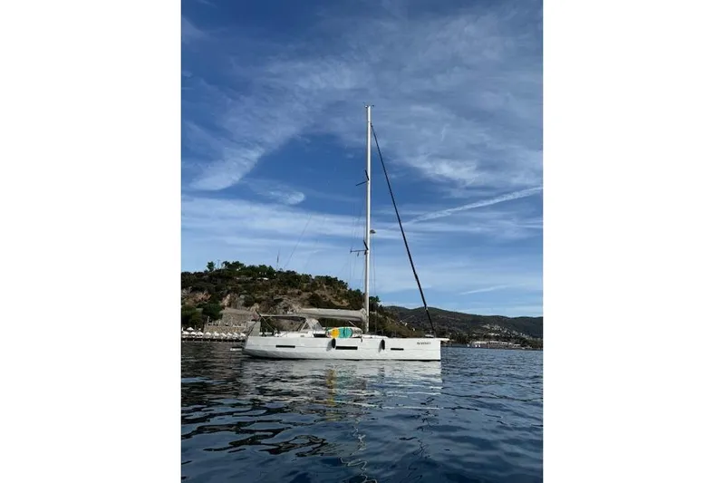  Yacht Photos Pics 2015 Dufour 560 Grand Large sailboat on calm water under blue sky.