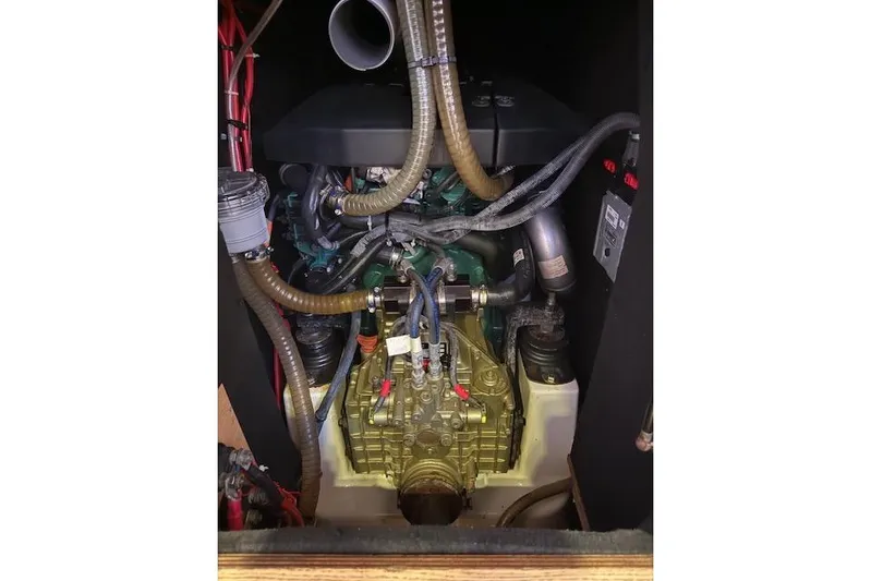  Yacht Photos Pics Engine compartment of a 2015 Dufour 560 Grand Large sailboat, showcasing mechanical components.