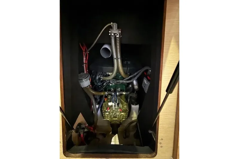  Yacht Photos Pics Engine compartment of 2015 Dufour 560 Grand Large sailboat, showcasing mechanical components.