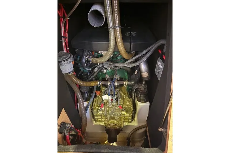  Yacht Photos Pics Engine compartment of a 2015 Dufour 560 Grand Large sailboat, showcasing mechanical components.