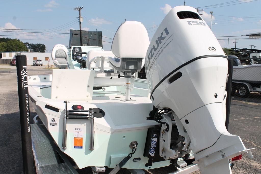 2026 Excel Bay Pro Elite 203 boat with Suzuki 150 engine on trailer.