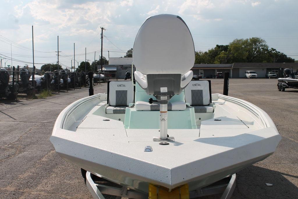 2026 Excel Bay Pro Elite 203 boat, front view in a parking lot.
