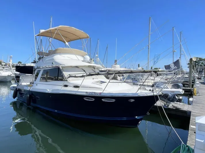 Elaine Hope Yacht Photos Pics 2017 Cutwater C-30 CB yacht docked at marina under clear blue sky.
