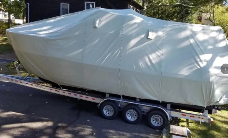 Elaine Hope Yacht Photos Pics Covered 2017 Cutwater C-30 CB boat on a trailer, parked outdoors.