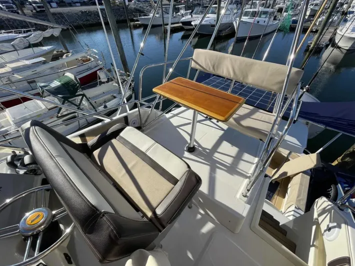Elaine Hope Yacht Photos Pics 2017 Cutwater C-30 CB boat cockpit with seating and table, docked at marina.