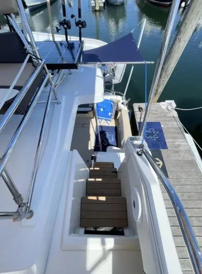 Elaine Hope Yacht Photos Pics 2017 Cutwater C-30 CB boat docked, featuring upper deck and wooden steps.