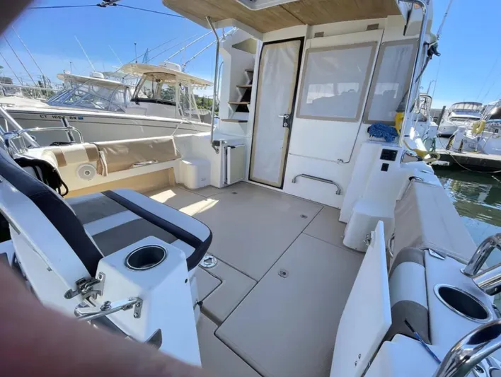 Elaine Hope Yacht Photos Pics 2017 Cutwater C-30 CB boat interior with seating and fishing equipment.