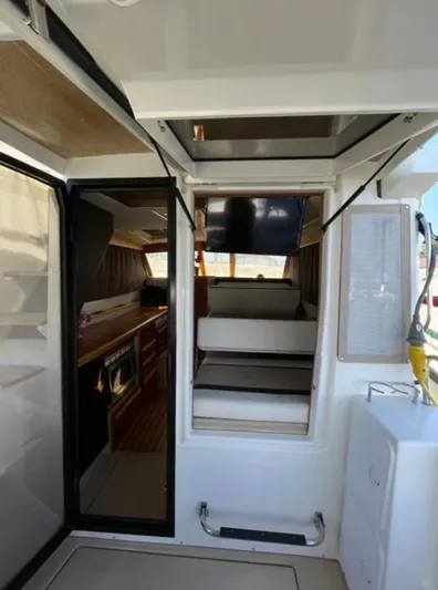 Elaine Hope Yacht Photos Pics 2017 Cutwater C-30 CB interior with modern kitchen and cozy seating area.