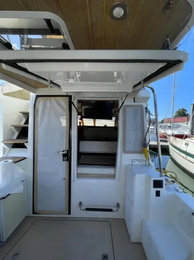 Elaine Hope Yacht Photos Pics 2017 Cutwater C-30 CB boat interior with open door and steps, docked at marina.
