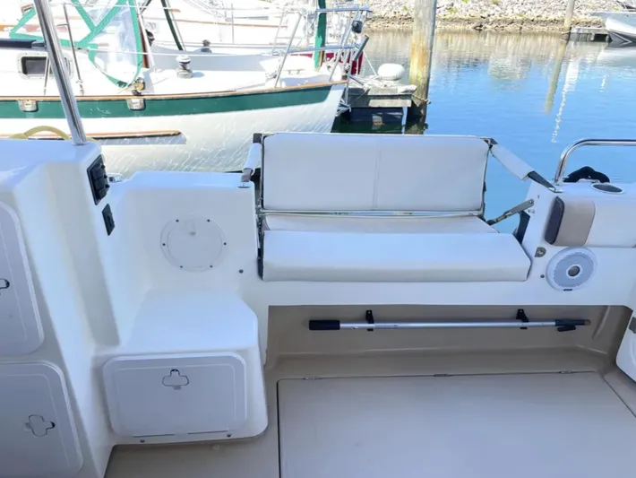Elaine Hope Yacht Photos Pics 2017 Cutwater C-30 CB boat interior with white seating and storage compartments.