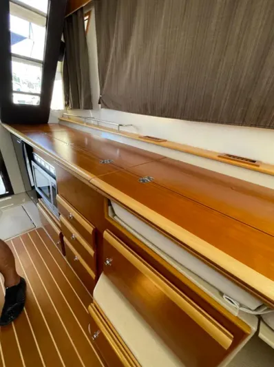 Elaine Hope Yacht Photos Pics Interior of 2017 Cutwater C-30 CB boat with wooden cabinetry and flooring.