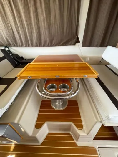 Elaine Hope Yacht Photos Pics 2017 Cutwater C-30 CB interior with wooden table and cup holders.