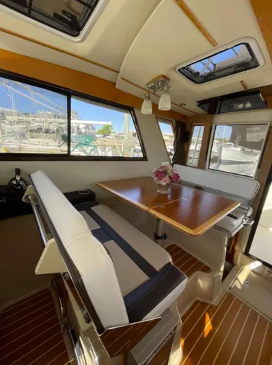 Elaine Hope Yacht Photos Pics Interior of 2017 Cutwater C-30 CB boat with dining area and large windows.