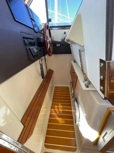 Elaine Hope Yacht Photos Pics 2017 Cutwater C-30 CB helm with wood accents and modern controls.