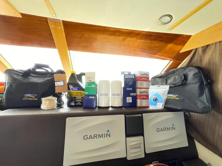 Elaine Hope Yacht Photos Pics Cutwater C-30 CB 2017 boat interior with Garmin equipment and maintenance supplies.