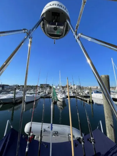 Elaine Hope Yacht Photos Pics 2017 Cutwater C-30 CB boat with fishing rods, docked at a marina under clear blue skies.