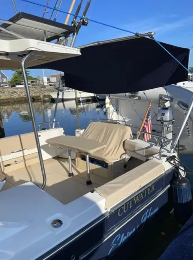 Elaine Hope Yacht Photos Pics 2017 Cutwater C-30 CB boat docked, featuring shaded seating and sleek design.