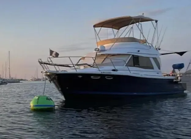 Elaine Hope Yacht Photos Pics 2017 Cutwater C-30 CB boat anchored near a buoy at sunset.