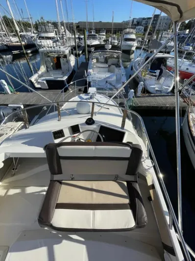 Elaine Hope Yacht Photos Pics 2017 Cutwater C-30 CB boat docked at a marina, surrounded by other vessels.