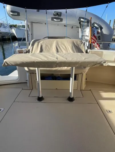 Elaine Hope Yacht Photos Pics 2017 Cutwater C-30 CB boat interior with covered seating and docked surroundings.