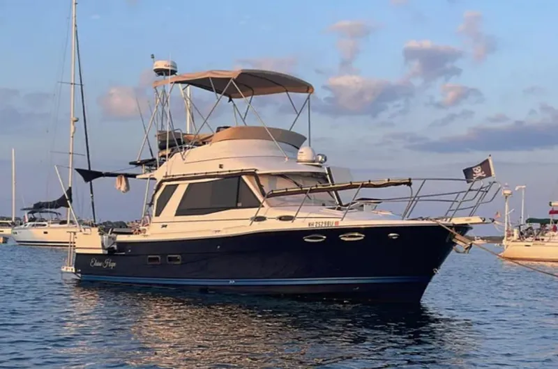 Elaine Hope Yacht Photos Pics 2017 Cutwater C-30 CB boat anchored on calm water at sunset.