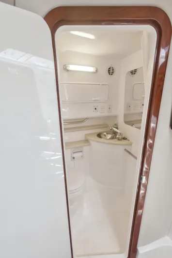 Swift Serenity Yacht Photos Pics 2008 Fountain 38 Sport Cruiser bathroom interior with sink and toilet.