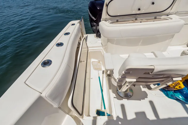 Swift Serenity Yacht Photos Pics 2008 Fountain 38 Sport Cruiser deck with seating and storage, overlooking water.