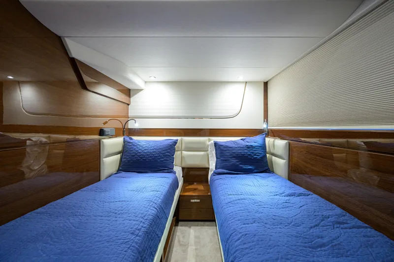 Miss Amy Yacht Photos Pics Luxurious twin cabin interior of 2020 Princess F70 yacht with blue bedding.