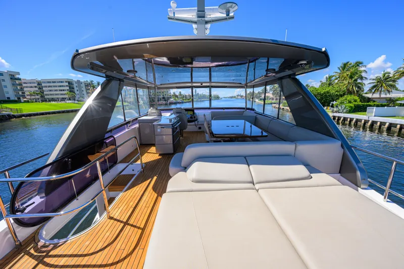 Miss Amy Yacht Photos Pics Luxurious 2020 Princess F70 yacht with spacious deck and modern amenities, cruising on a sunny day.