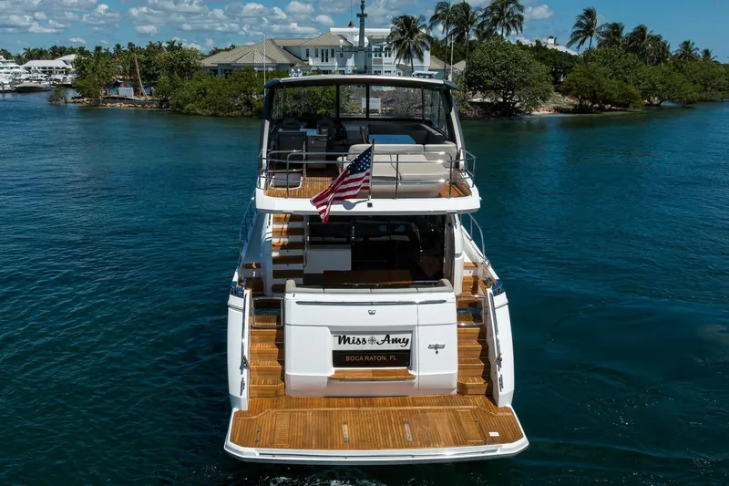 Miss Amy Yacht Photos Pics Luxury 2020 Princess F70 yacht on serene water, rear view with American flag.