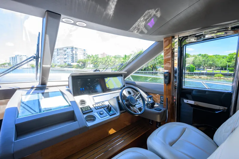 Miss Amy Yacht Photos Pics Luxurious 2020 Princess F70 yacht cockpit with modern navigation controls and waterfront view.