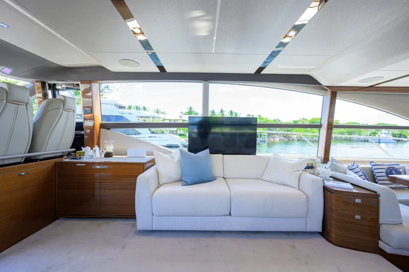 Miss Amy Yacht Photos Pics Luxurious interior of 2020 Princess F70 yacht with elegant seating and scenic window view.
