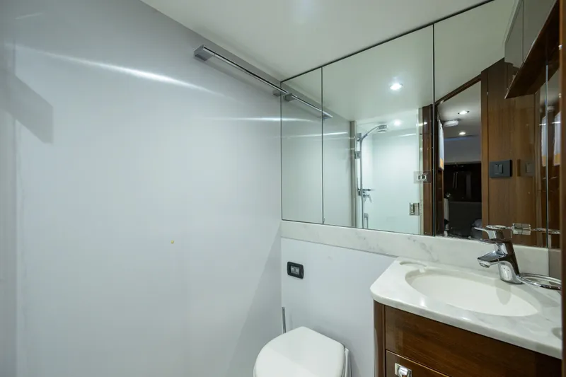 Miss Amy Yacht Photos Pics Luxurious bathroom in 2020 Princess F70 yacht with modern fixtures and mirrored cabinets.