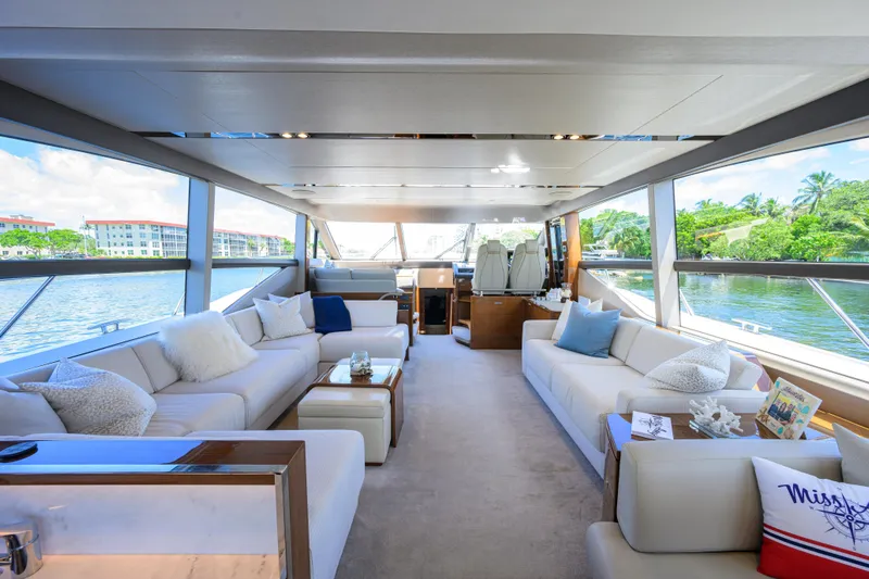 Miss Amy Yacht Photos Pics Luxurious interior of 2020 Princess F70 yacht with elegant seating and panoramic windows.